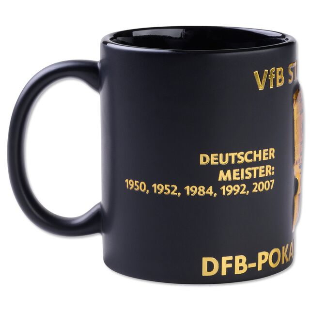 schwarze Tasse mit goldener Aufschrift Deutscher Meister: 1950, 1952, 1984, 1992, 2007