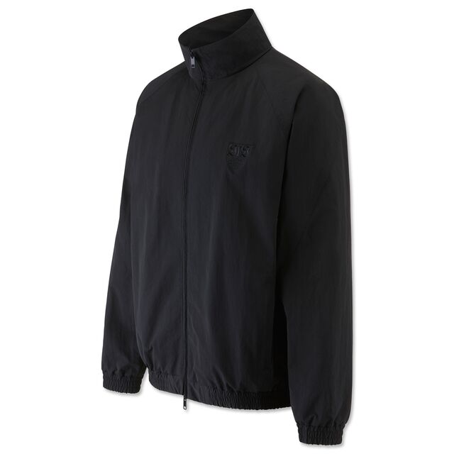 schwarze Trainingsjacke mit Reißverschluss und kleinem VfB Logo auf der Brust